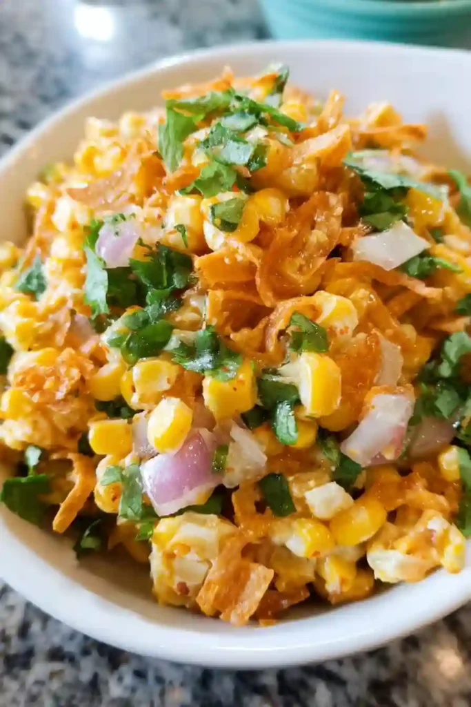 Frito Corn Salad Crushed Chili Cheese Fritos being added to the salad mixture just before serving