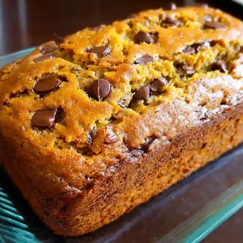 Freshly baked pumpkin banana bread on a cutting board