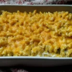 Homemade mac and cheese made with elbow macaroni, cheddar cheese, milk, butter, and baked to golden perfection