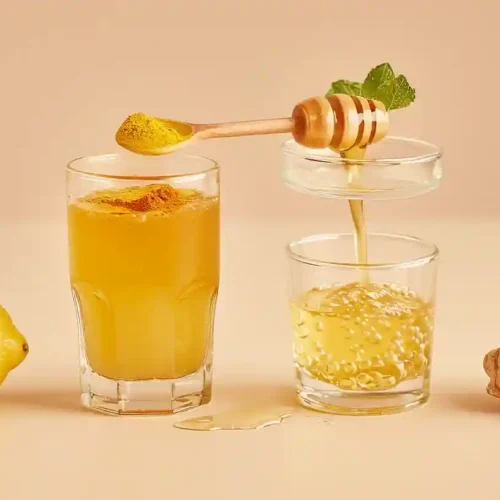 Natural Mounjaro Recipe (Advanced Guide) Natural Mounjaro Recipe Flat lay of lemon halves, ginger slices, mint, turmeric, honey, apple cider vinegar, water, and measuring spoons on an off-white surface.