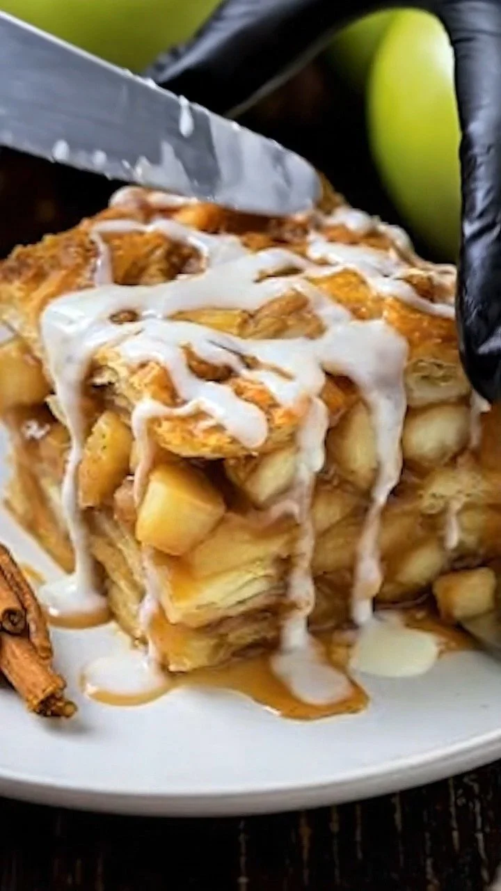 Delicious cinnamon roll apple lasagna with layers of cinnamon rolls and apples