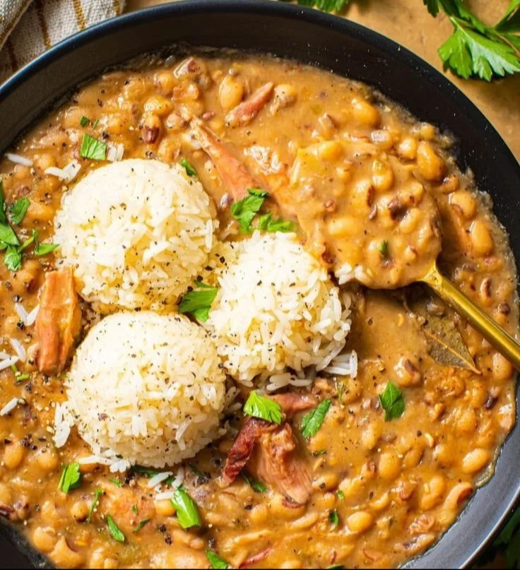 Creamy Southern black-eyed peas dish served in a bowl with herbs on top