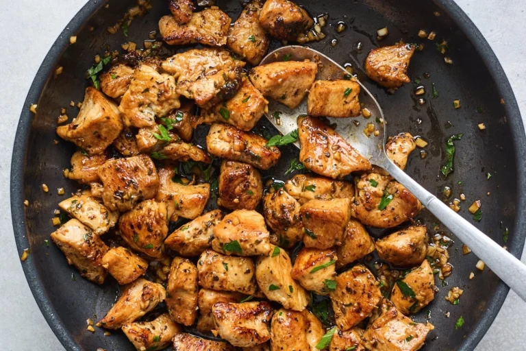 Plate of delicious Garlic Butter Chicken Bites served with herbs