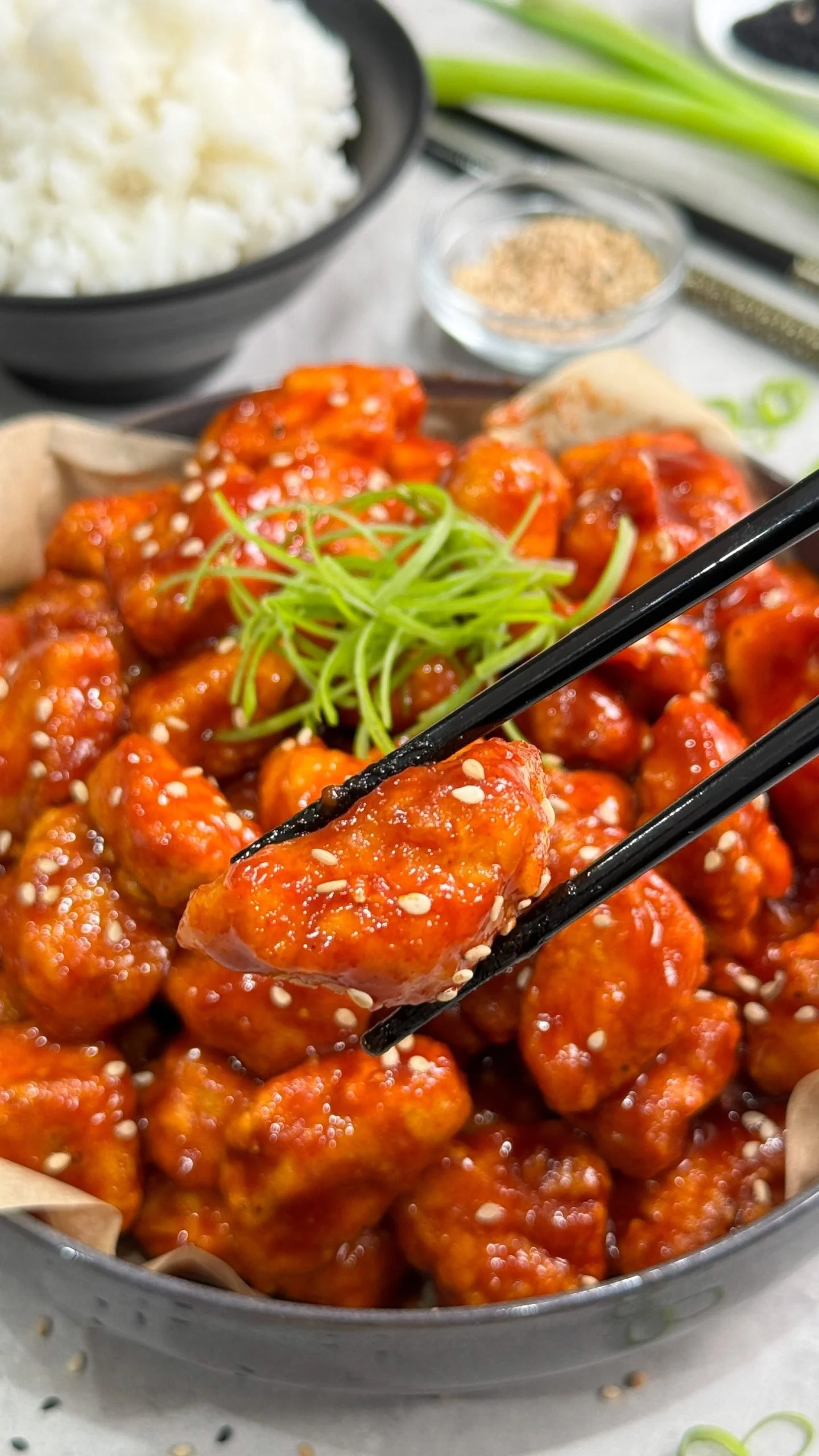 Plate of healthy Korean fried chicken served with fresh vegetables