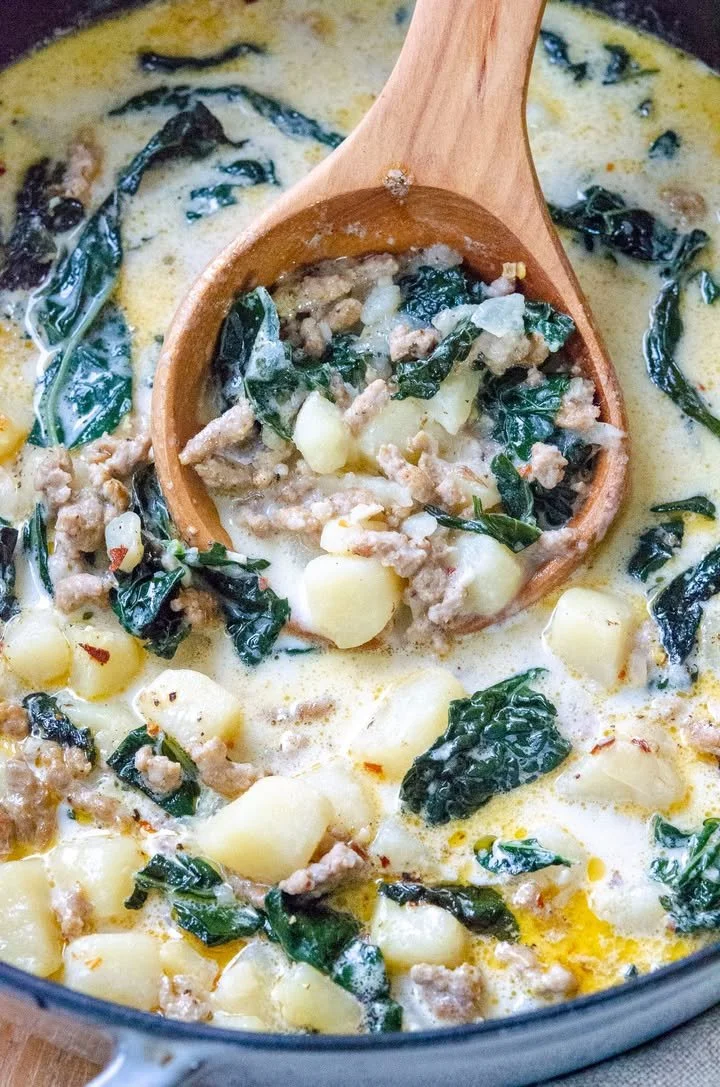 Bowl of homemade Olive Garden soup with fresh ingredients and herbs