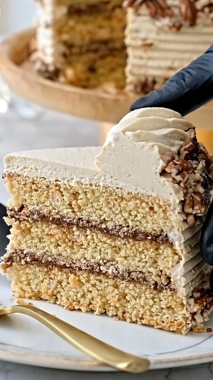 Delicious pecan pie cake dessert topped with pecans and caramel sauce