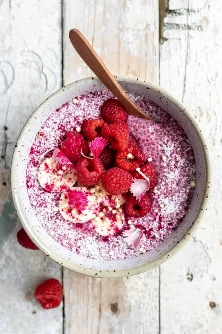 Delicious Raspberry Chia Pudding topped with fresh raspberries and mint