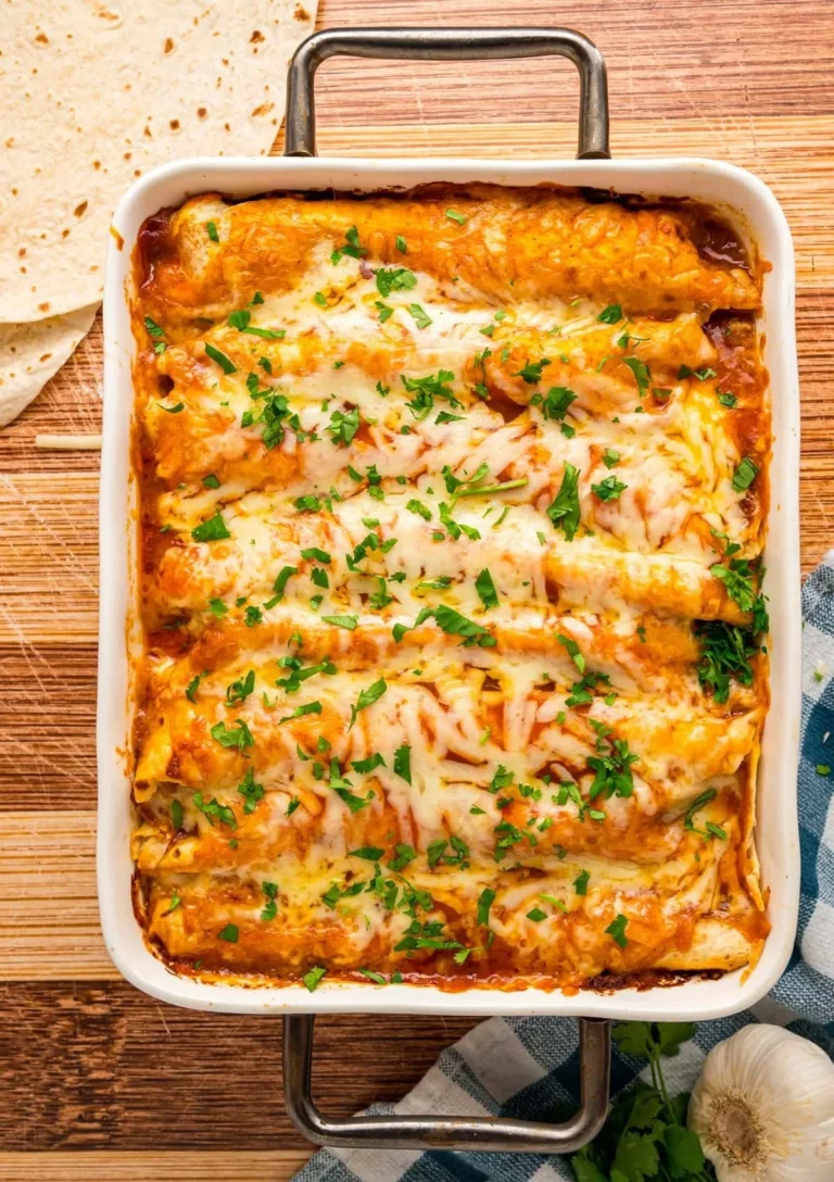 Delicious Chicken Enchiladas topped with cheese and sauce
