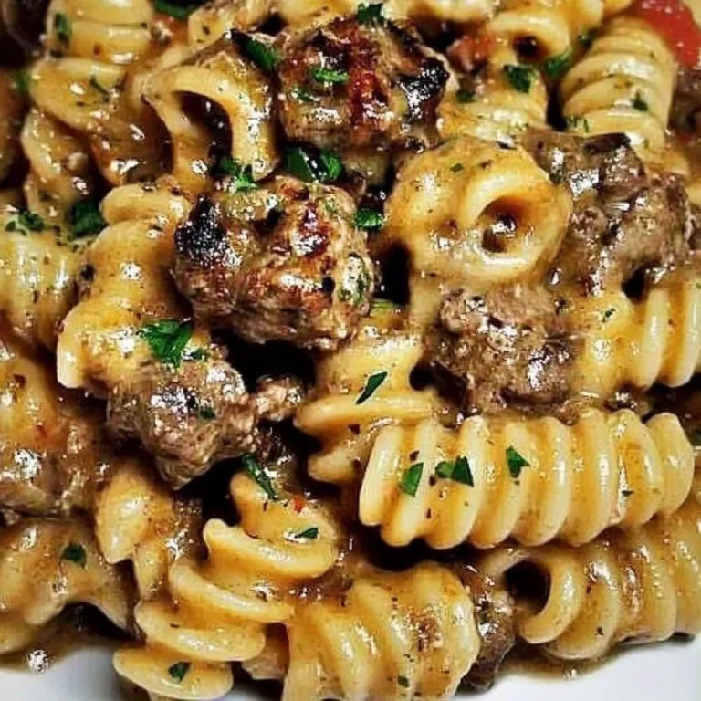 Creamy paprika steak shells served in a bowl with herbs and spices