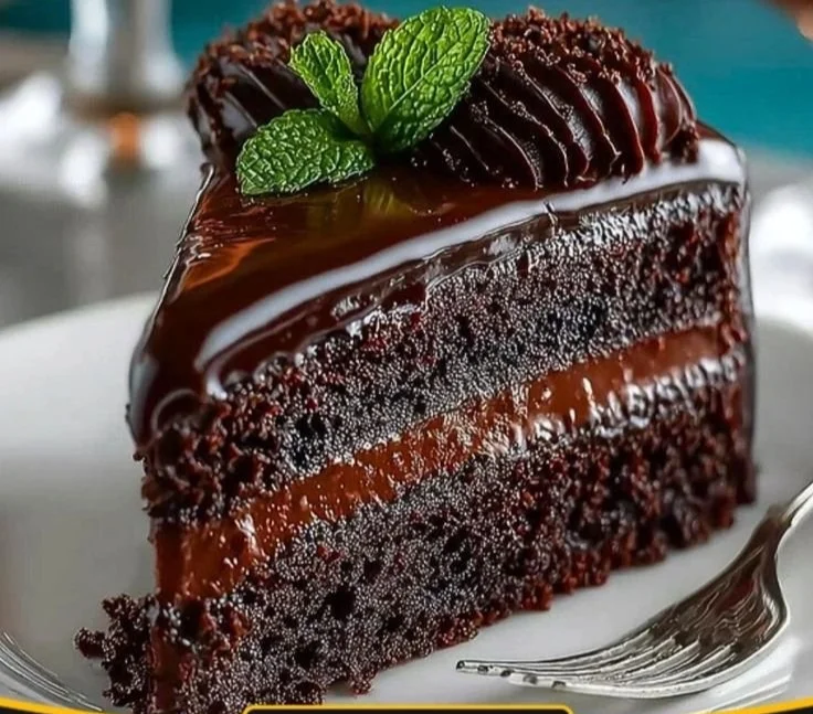 Decadent Midnight Fudge Cake topped with rich chocolate ganache and sprinkles