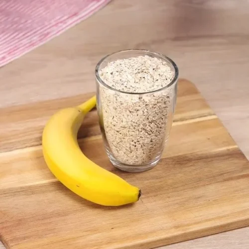 Delicious Oat Cocoa Banana Dessert served in a bowl with a spoon.