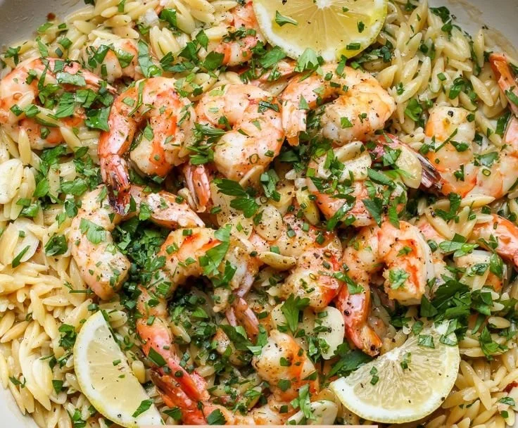 Shrimp scampi orzo dish with garlic and herbs