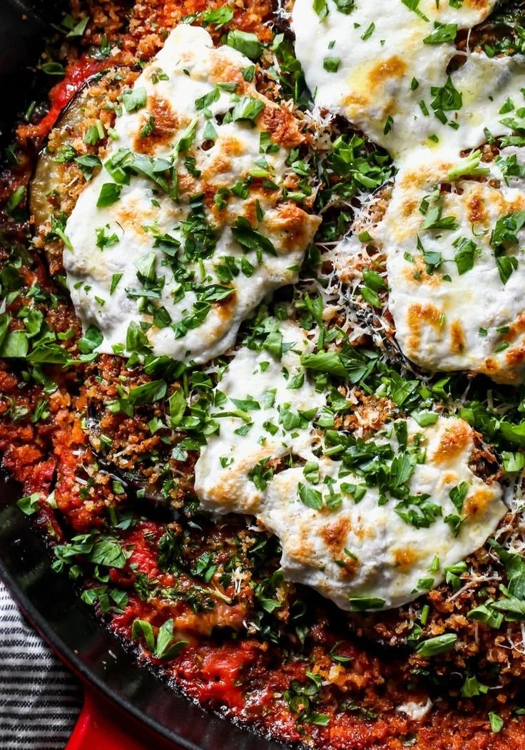 Delicious skillet eggplant parmesan with layers of cheese and tomato sauce