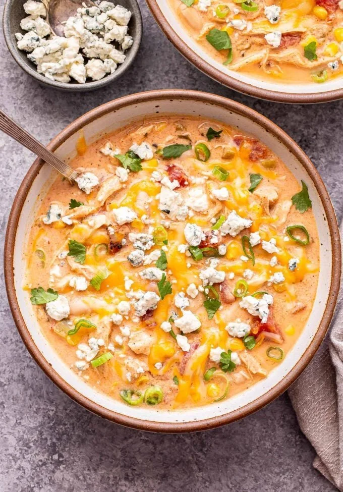 Bowl of Slow Cooker Buffalo Chicken Chili topped with green onions
