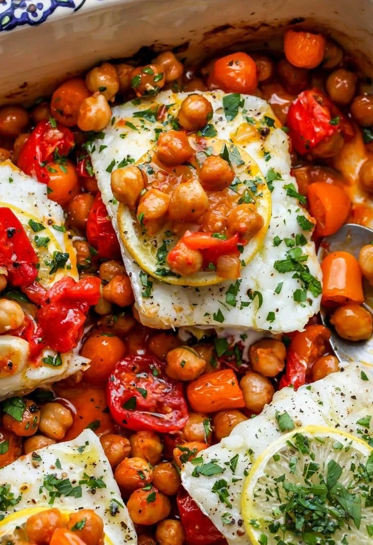 Spicy Moroccan Baked Fish garnished with herbs and spices on a plate