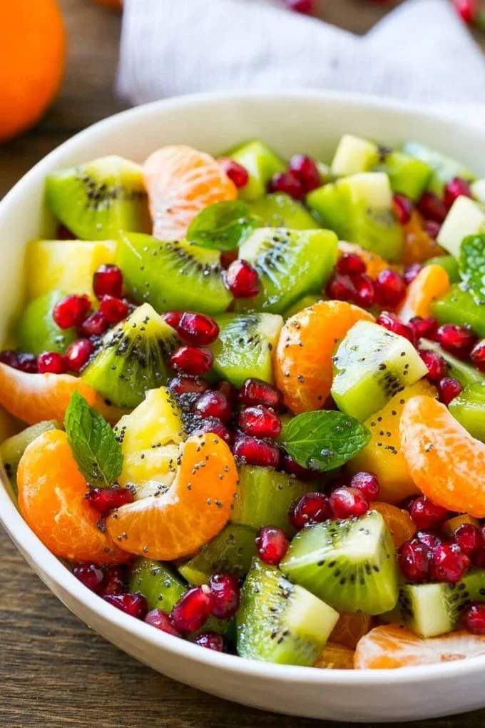 Colorful winter fruit salad with seasonal fruits in a bowl