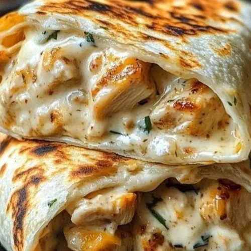Delicious cheesy chicken garlic wraps served on a plate
