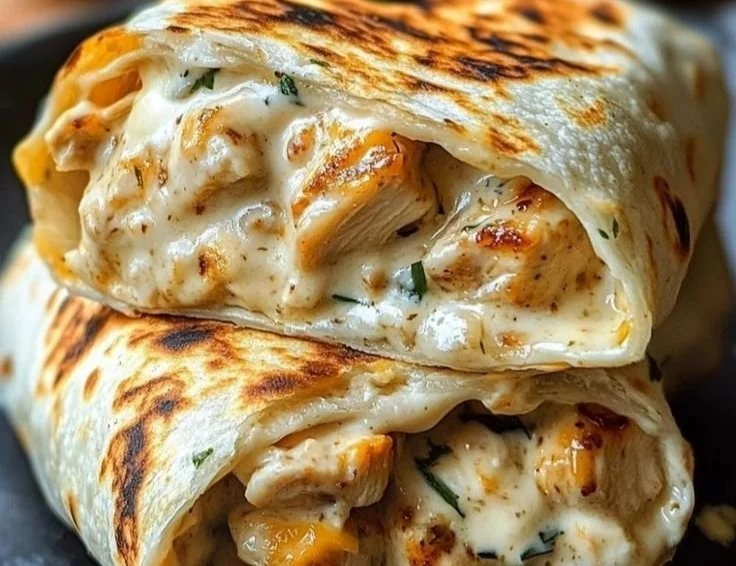Delicious cheesy chicken garlic wraps served on a plate