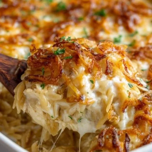 Delicious French Onion Chicken Orzo Casserole served in a dish.