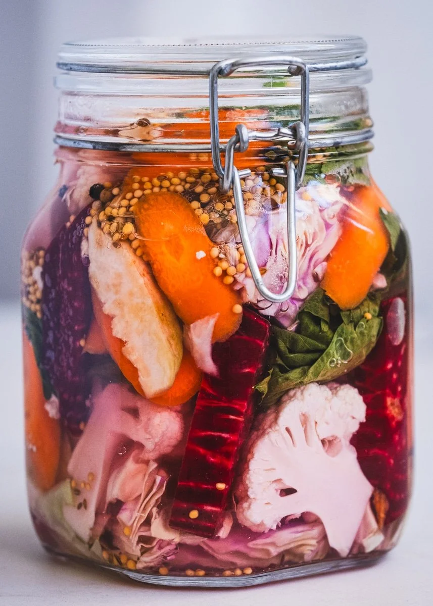 Bowl of colorful mixed fermented vegetables ready to enjoy