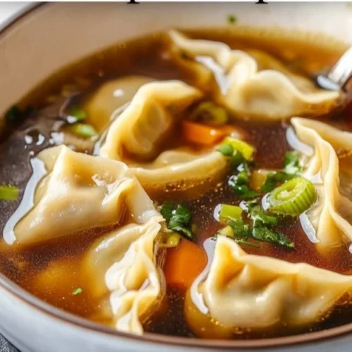 Delicious Potsticker Soup served in a bowl with green onions and herbs