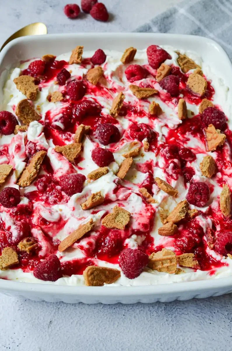 Delicious Speculoos Raspberry Tiramisu dessert with layers of cream and raspberry